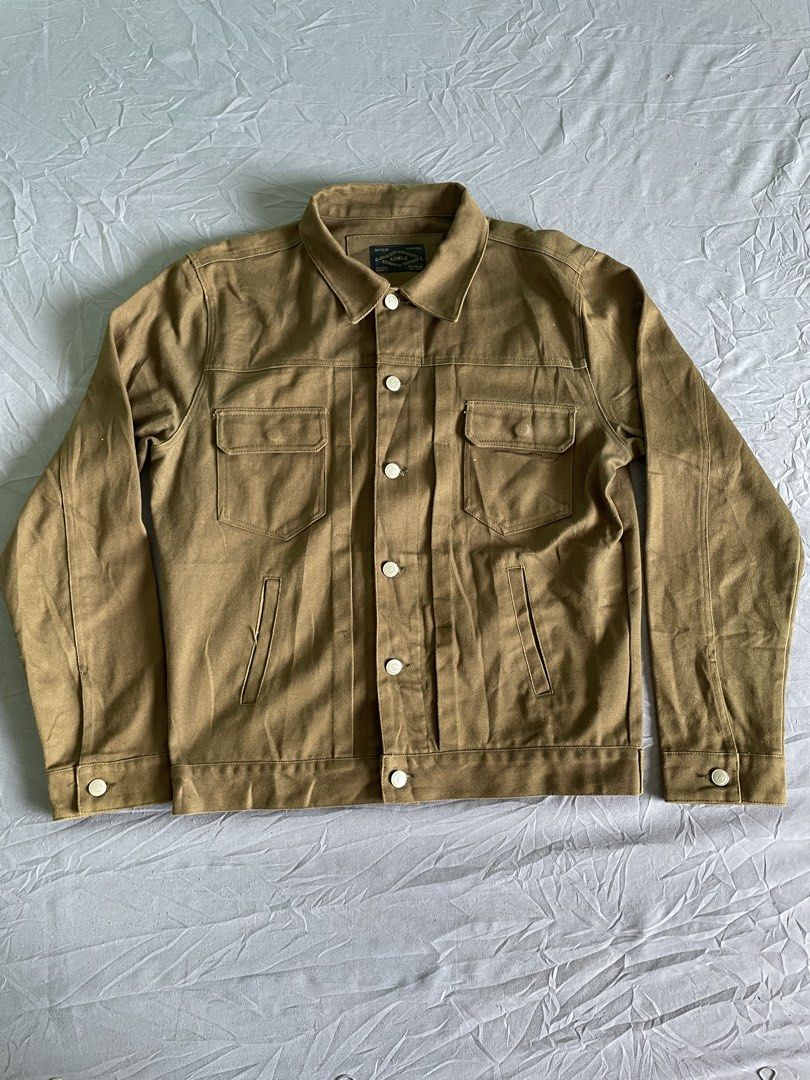 ADLE Adam's Fig Leaf Brown Jacket Size L (Category: Coats, Jackets and Outerwear) located in Cagayan de Oro. Submitted by jekdels05 (Listing ID 1468503492, Image 1). Description: - Brand/Model: ADLE Adam's Fig Leaf brown denim style work jacket - Size: L - Material: Heavy cotton twill fabric with contrast buttons - Pockets: Dual chest flap pockets and side welt pockets - Measurements: Chest width ~22 inches, Length ~29 inches - Style: Rugged util