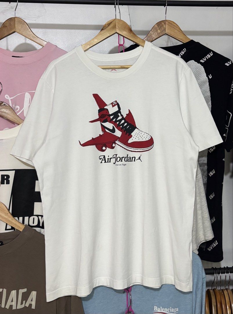 Air Jordan First in Flight Graphic White Tee (Category: Tshirts & Polo Shirts ) located in Tarlac. Submitted by thirstthriftapparelz_ (Listing ID 1468687700, Image 2). Description: Brand: Jordan Condition:Excellent Size: Large Color rate:9.5 Issue:None.