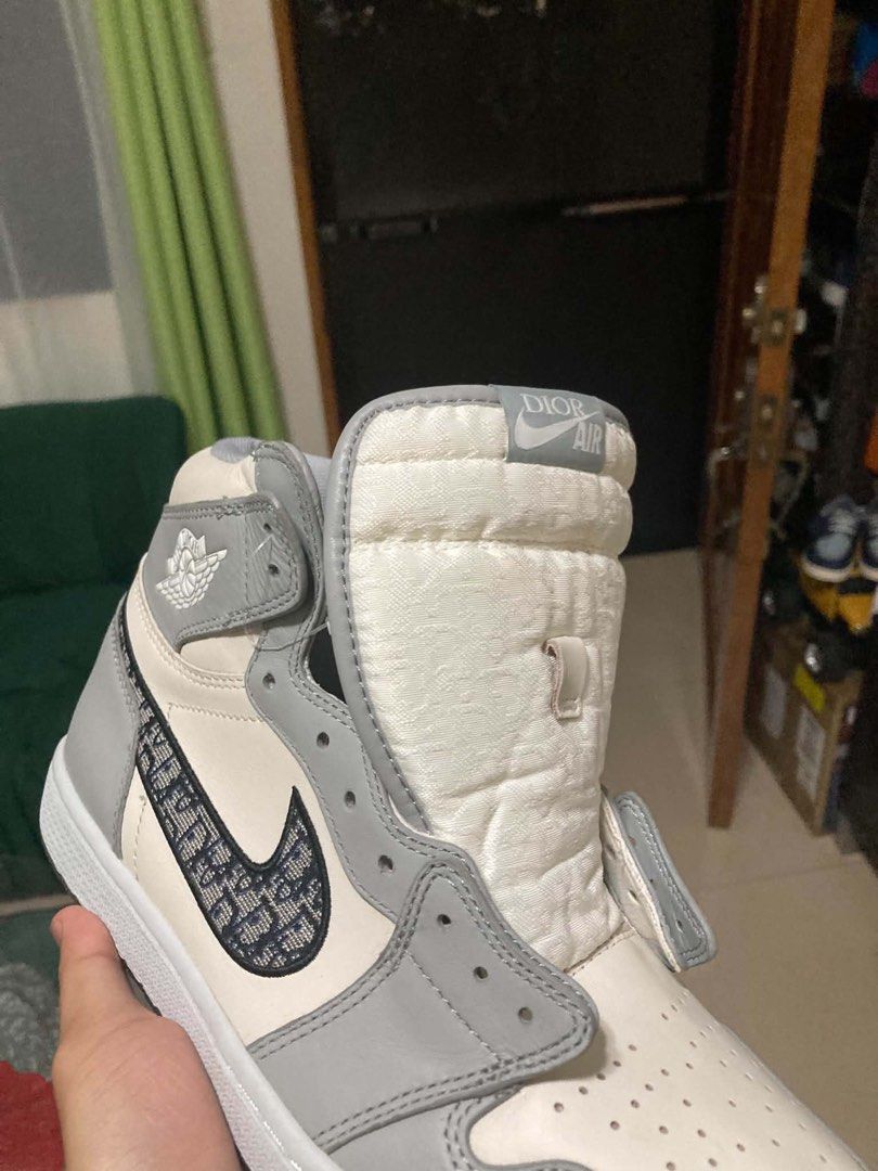 AIR JORDAN x DIOR (Category: Sneakers & Footwear) located in Dapitan. Submitted by thrift_archive2026 (Listing ID 1468649665, Image 2). Description: AIR JORDAN x DIOR 👟 Colorway:White / Gray Style:High-top basketball sneakers (OFF/LEGIT ONLY) Design:Monogram-patterned Swoosh, Air Dior-style Wings logo, lace-up closure, ankle strap, and decorative metal charms Look:Premium streetwear aesthetic — perfect for casual outfits and sneaker collections 