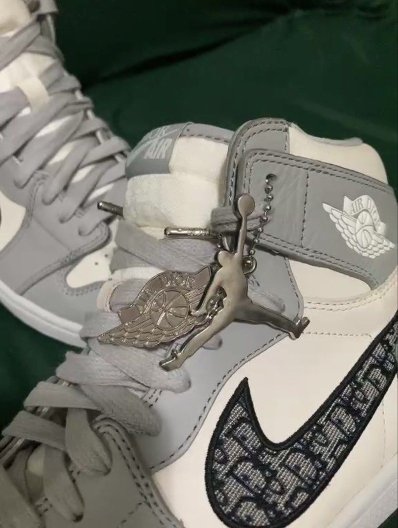 AIR JORDAN x DIOR (Category: Sneakers & Footwear) located in Dapitan. Submitted by thrift_archive2026 (Listing ID 1468649665, Image 3). Description: AIR JORDAN x DIOR 👟 Colorway:White / Gray Style:High-top basketball sneakers (OFF/LEGIT ONLY) Design:Monogram-patterned Swoosh, Air Dior-style Wings logo, lace-up closure, ankle strap, and decorative metal charms Look:Premium streetwear aesthetic — perfect for casual outfits and sneaker collections 