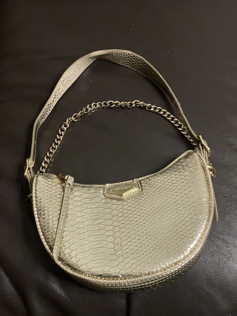 Aldo Gold Snakeskin Shoulder Bag (Category: Shoulder Bags) located in Manila. Submitted by amberwinslow (Listing ID 1468596018, Image 1). Description: PRELOVED GOLD ALDO SNAKESKIN MINI BAG/SHOULDER BAG NEGOTIABLE PRICE RUSH SELLING.