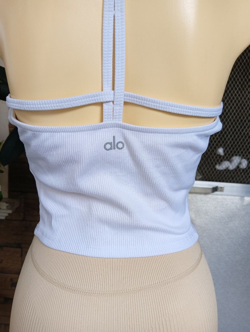ALO Yoga Tank Top (Category: Activewear) located in Rizal. Submitted by timeless_shop (Listing ID 1468549015, Image 2). Description: Original ALO YOGA Ribbed 👚 Type: Ribbed T-Back Crop Top 📏 Size: LARGE Fit Bust 34-36 Meron Removable Cup pad 🧵 Fabric: Premium Ribbed 🎨 Color: White - Very Nice Color! ⭐ Condition Rate: 9/10 - LIKE NEW! 🌈 Color Rate: 9/10 - White Maayos at malinis din ito 📍 Location: Rizal 💳 Payment first Gcash BPI 🚚 Shippin