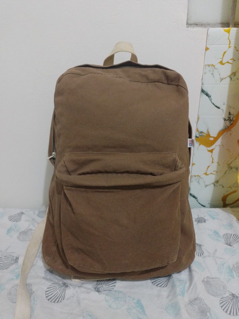 American Apparel Canvas Backpack Brown Made in USA (Category: Backpacks) located in Imus. Submitted by bestfinds_yeth0724 (Listing ID 1468653475, Image 1). Description: - Brand: American Apparel - Origin: Made in USA - Material: Sturdy brown canvas - Compartments: Main zip compartment + exterior front zip pocket - Features: Adjustable back straps - Style: Neutral, simple everyday backpack MOP gcash Locstion Imus Cavite.