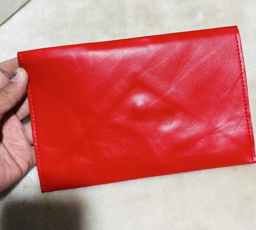 Anna Sui Red Envelope Clutch (Category: Clutches) located in Mandaue City. Submitted by chuchi152615 (Listing ID 1468573551, Image 2). Description: - Brand: Anna Sui - Color: Bright red with gold-tone hardware - Material: Faux leather - Design: Envelope clutch featuring a cute embroidered mouse graphic on the front - Closure: Secure magnetic snap - Dimensions: Approx. 20 cm x 11.5 cm - Interior: Clean with a small branded fabric tag - Condition: 