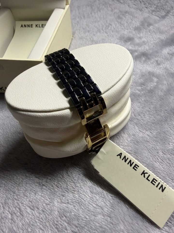 Anne Klein Rectangular Two-Tone Ceramic Watch with Box (Category: Women's Watches) located in Caloocan City. Submitted by Appareildemusique (Listing ID 1468558224, Image 3). Description: - Brand: Anne Klein - Dial: Rectangular black dial with gold-tone case - Strap: Ceramic and metal bracelet - Condition: Brand new with original branded presentation box, price tag, and international warranty booklet - Style: Classic, versatile for casual or forma