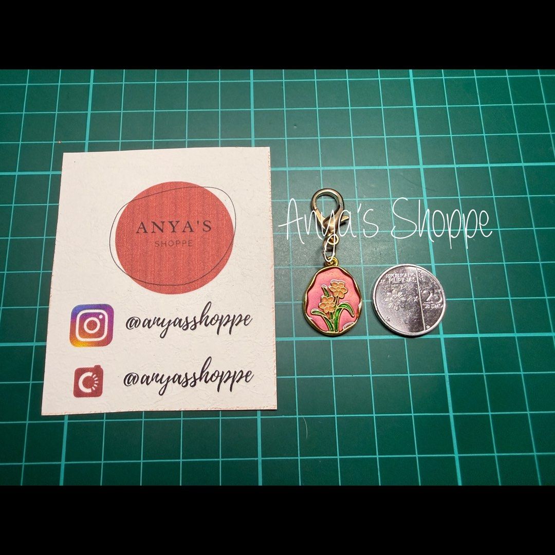 Floral Enamel Journal Charms (Category: Charms) located in Paranaque City. Submitted by anyasshoppe (Listing ID 1468705853, Image 2). Description: - 4 vibrant enamel charms for your journals - Includes pink, red, white, and orange floral designs Disclaimer: Actual color varies on the photos due to lighting conditions - Features gold-tone metal hardware and secure clasps - Coin-sized for versatile use (shown next to a 25-centavo piece for scale) -