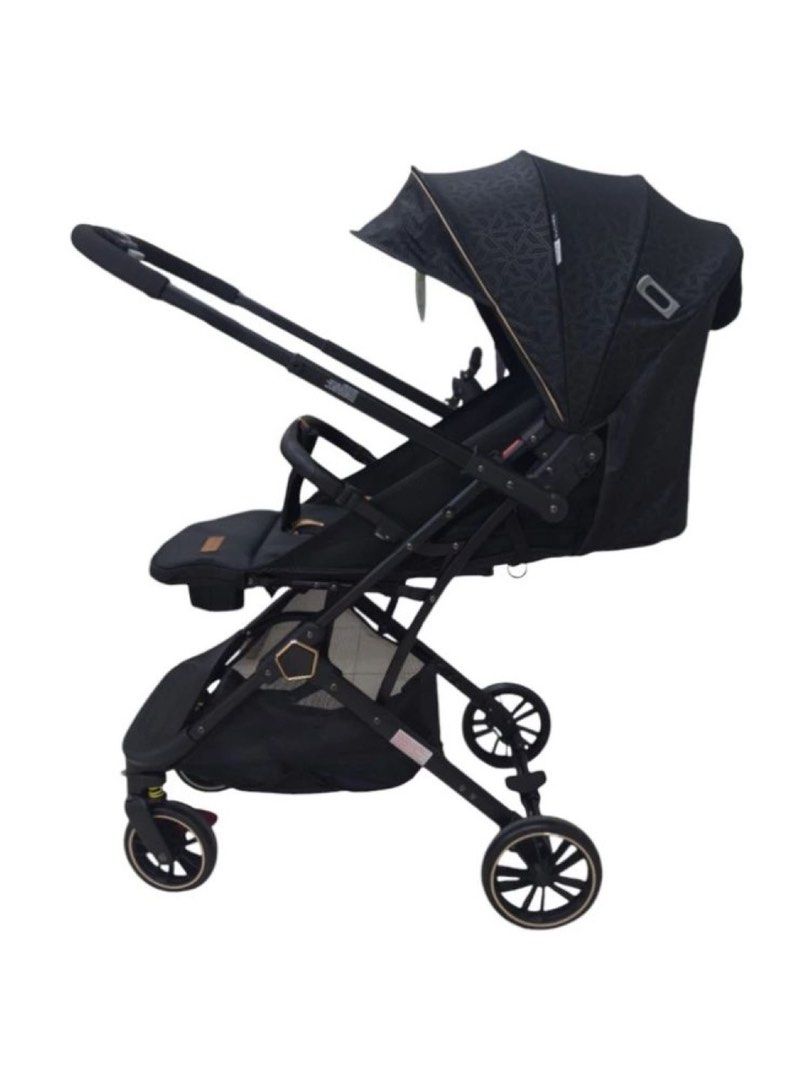 Apruva Axel Compact Baby Stroller (Category: Strollers) located in Manila. Submitted by heyitsmegracie (Listing ID 1468576374, Image 3). Description: - Brand: Apruva Axel baby stroller in sleek black - Condition: Clean, well-maintained, and fully functional - Compact & Travel-Friendly: Folds down easily with an integrated pull handle for luggage-style transport - Comfort & Safety: Features an adjustable canopy, secure gold-tone safety harness str