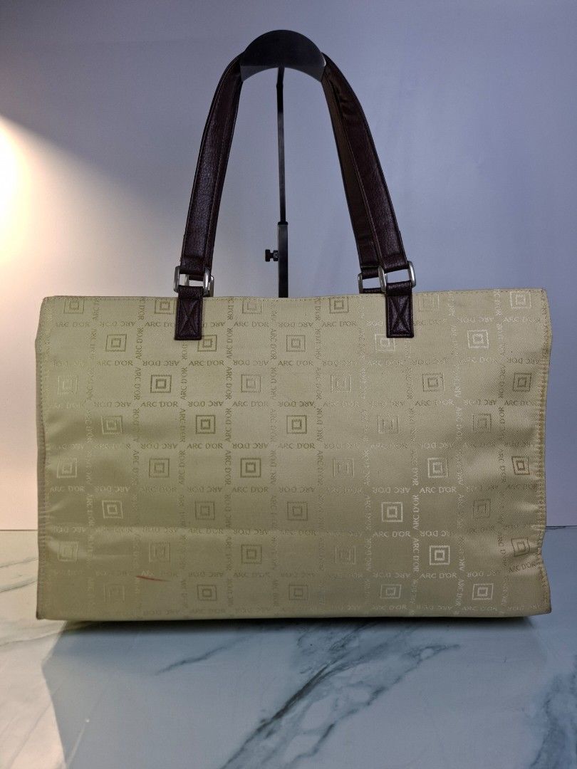 ARC D'OR Monogram Tote Bag Cream Brown (Category: Tote Bags) located in Pasay City. Submitted by onick_79 (Listing ID 1468693801, Image 2). Description: - Brand/Model: ARC D'OR Tote Bag - Color/Design: Cream fabric with brown monogram print, accented with dark brown faux leather - Features: Secure zip top closure, matching front pocket flaps, and a spacious everyday interior - Condition: Clean inside and out, ready to use - Dimensions L 40 X H 28
