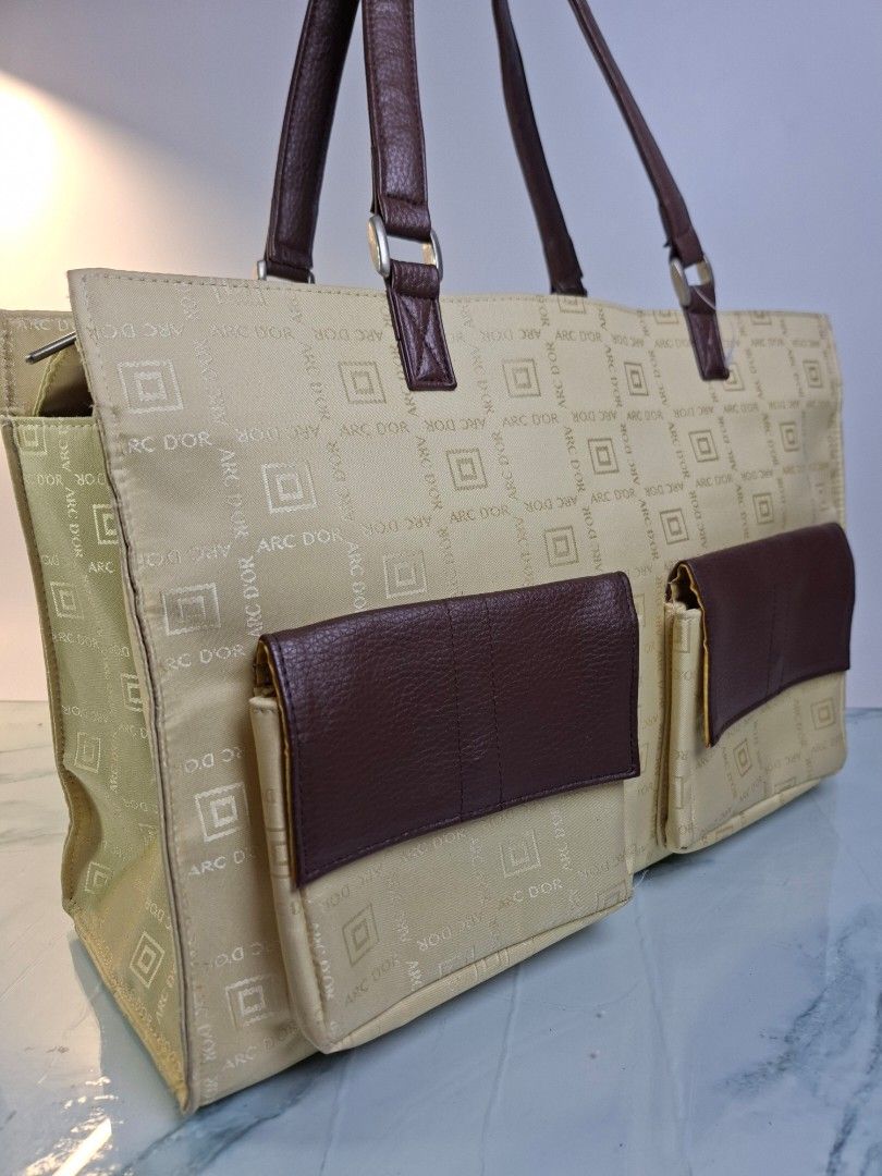 ARC D'OR Monogram Tote Bag Cream Brown (Category: Tote Bags) located in Pasay City. Submitted by onick_79 (Listing ID 1468693801, Image 3). Description: - Brand/Model: ARC D'OR Tote Bag - Color/Design: Cream fabric with brown monogram print, accented with dark brown faux leather - Features: Secure zip top closure, matching front pocket flaps, and a spacious everyday interior - Condition: Clean inside and out, ready to use - Dimensions L 40 X H 28