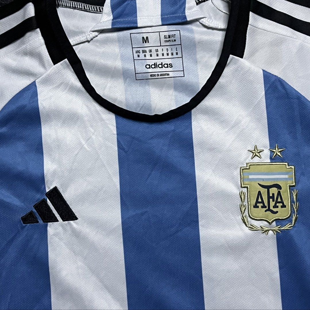 Argentina Home Soccer Jersey (Category: Others Tops) located in Davao. Submitted by archived.status (Listing ID 1462177641, Image 2). Description: COLOR MAY VARY DUE TO LIGHTING‼️ Condition: 9.5/10 Color rate: 9.5/10, or better Issue: N/A Size Medium Width 17 Length 25.