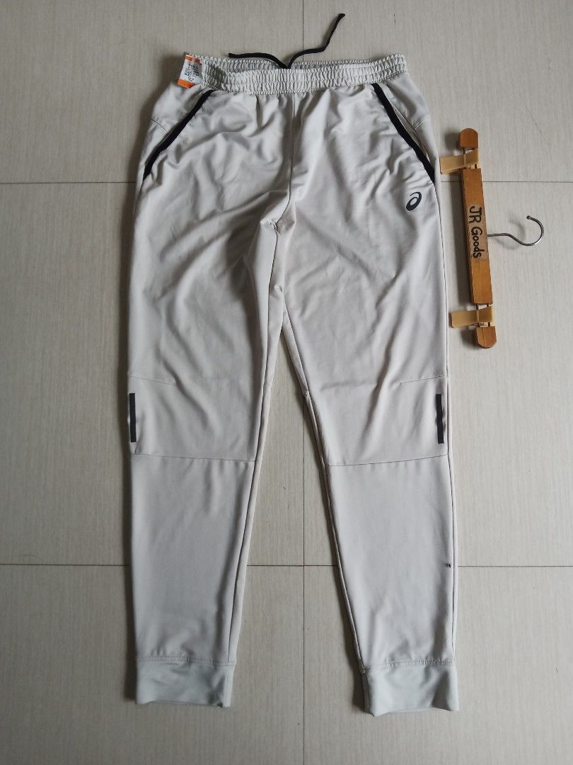 Asics Athletic Jogger (Category: Joggers) located in Tanay. Submitted by jrgoods (Listing ID 1468510800, Image 1). Description: Asics jogger Medium Waistline 30-34 Length 39 Excellent to new condition 699+ship Tanay Rizal location Shipping Nationwide - Material: 86% polyester, 14% spandex (stretchable & lightweight) - Waistband: Elastic with adjustable black drawstring - Pockets: 2 secure side zippered pockets with black trim - Design: Tapered le