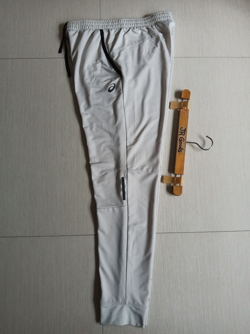 Asics Athletic Jogger (Category: Joggers) located in Tanay. Submitted by jrgoods (Listing ID 1468510800, Image 2). Description: Asics jogger Medium Waistline 30-34 Length 39 Excellent to new condition 699+ship Tanay Rizal location Shipping Nationwide - Material: 86% polyester, 14% spandex (stretchable & lightweight) - Waistband: Elastic with adjustable black drawstring - Pockets: 2 secure side zippered pockets with black trim - Design: Tapered le