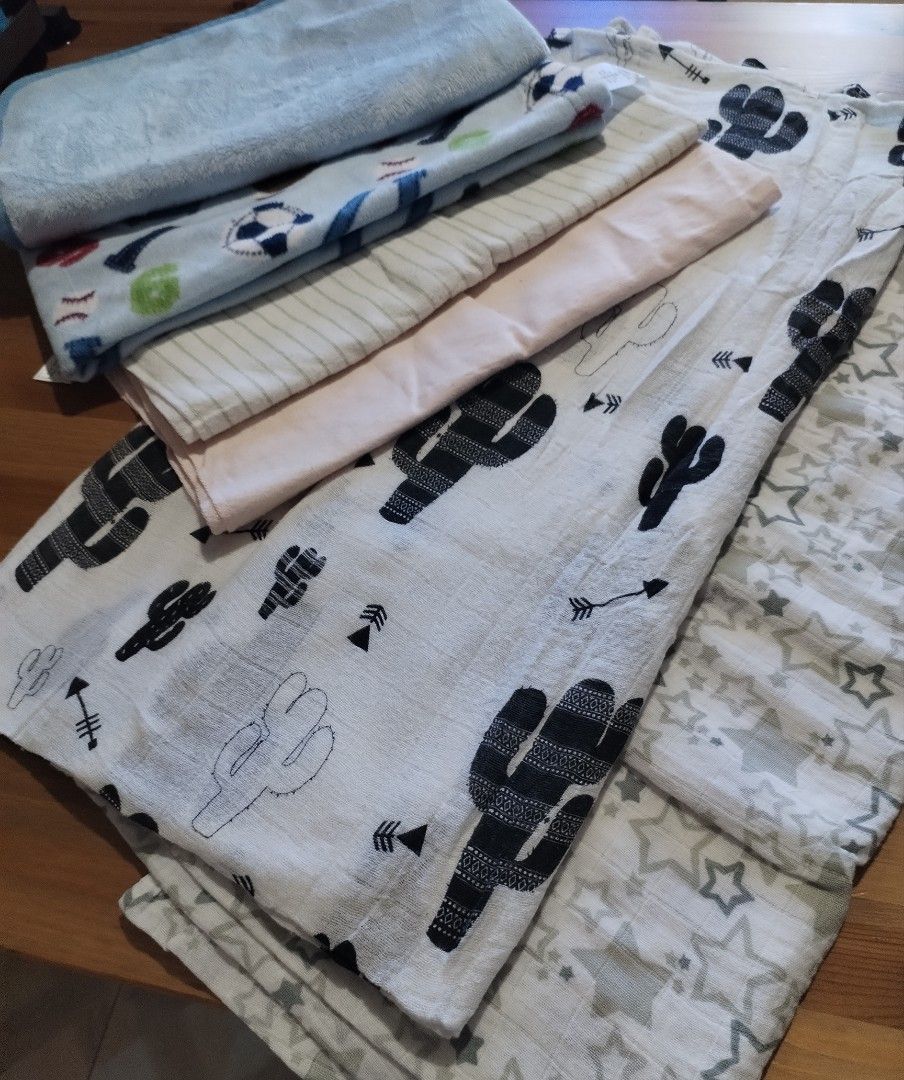Assorted Baby blankets (Category: Other Baby Bathing & Changing Needs) located in Muntinlupa City. Submitted by arciagamaryann68 (Listing ID 1468595631, Image 3). Description: - Assorted set of baby blankets and swaddles - Features various cute patterns including cacti, stars, sports balls, and stripes - Includes soft plush and breathable cotton-like fabrics - Selected items feature Carter's branding - Excellent pre-loved condition, clean and wel
