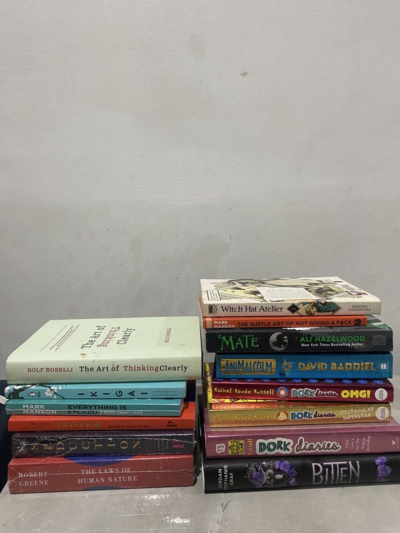 Assorted Fiction and Non-Fiction Books Bundle (Category: Storybooks) located in Caloocan City. Submitted by thampogi (Listing ID 1468593931, Image 1). Description: - Curated book bundle featuring popular authors like Robert Greene, Mark Manson, and Rachel Renée Russell - Great variety of genres including self-help, YA novels, manga (Witch Hat Atelier), psychology, romance, and daily journaling - Includes brand new volumes still wrapped in plastic