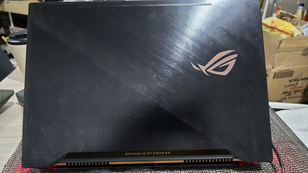 ASUS ROG Zephyrus GX501VS Gaming Laptop (Category: Laptops & Notebooks) located in Angeles City. Submitted by ar.rsd (Listing ID 1468669650, Image 2). Description: - Model: ASUS ROG Zephyrus GX501VS Gaming Laptop - Color: Black - Included: Original power cable and charging brick - Cooling: Features built-in folding stands on the bottom panel for better airflow - Condition: Heavy daily usage marks on the chassis, but works perfectly - LOW BATTERY 