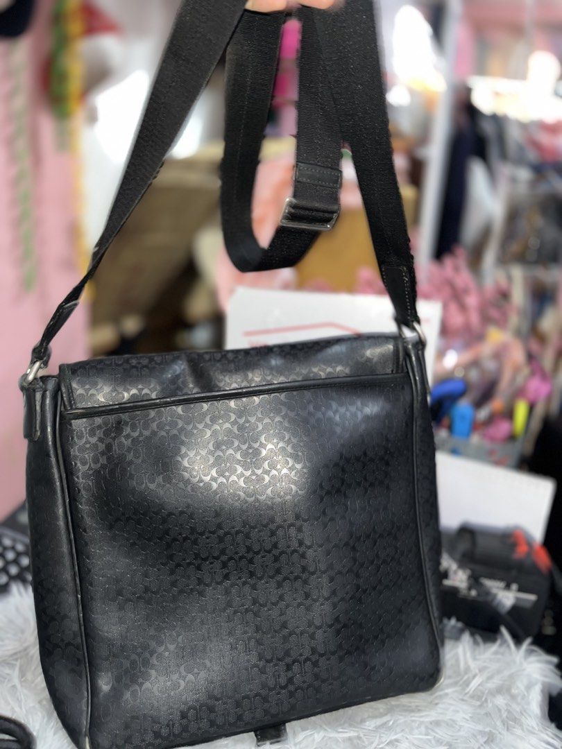 Authentic Coach Heritage Signature Map Messenger Bag (Black) (Category: Luxury Bags & Wallets) located in Larena. Submitted by jaiyuki (Listing ID 1468513162, Image 3). Description: Authentic Coach Heritage Signature Map Messenger Bag (Black) • Model/Style Number: F70765 (Auth Code: No. D1369-F70765) • Material: Durable embossed Signature “C” PVC coated canvas with genuine leather trim and piping. • Color & Hardware: Matte Black with brushed gunm
