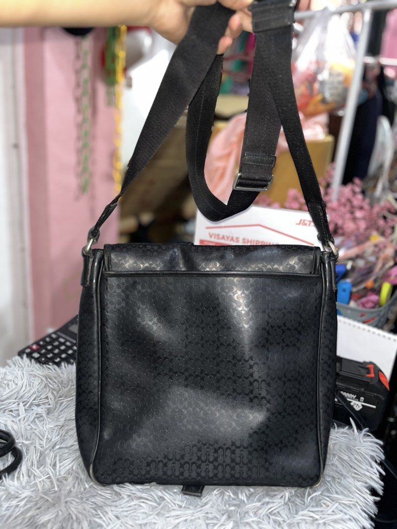 Authentic Coach Heritage Signature Map Messenger Bag (Black) (Category: Luxury Bags & Wallets) located in Larena. Submitted by jaiyuki (Listing ID 1468513162, Image 2). Description: Authentic Coach Heritage Signature Map Messenger Bag (Black) • Model/Style Number: F70765 (Auth Code: No. D1369-F70765) • Material: Durable embossed Signature “C” PVC coated canvas with genuine leather trim and piping. • Color & Hardware: Matte Black with brushed gunm
