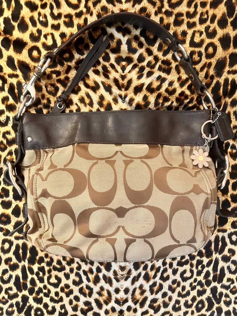 Authentic Coach Zoe Monogram Kili shoulder hobo bag (Category: Shoulder Bags) located in General Mariano Alvarez. Submitted by dreamgirlcloset (Listing ID 1468529088, Image 2). Description: Has minimal scrubs on canvas just see deets but not visible in person! Very y2k bag! Dm me for more deets! Ig shop: @retropeeps.garage.