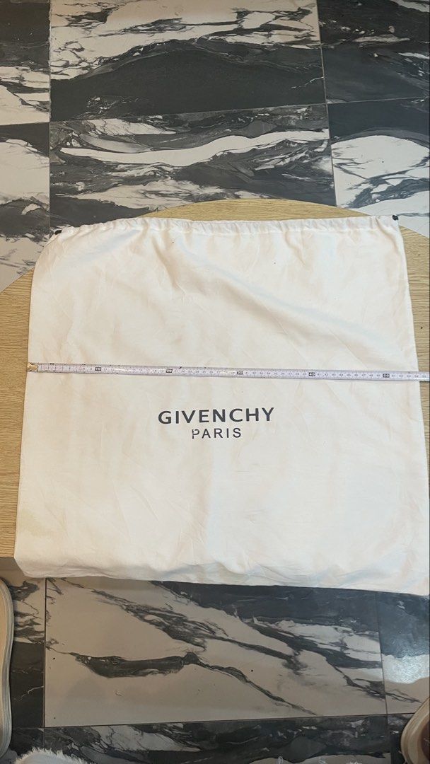 Authentic givenchy big dust bag (Category: Luxury Apparel) located in Cavite. Submitted by ohmie23 (Listing ID 1468687445, Image 1). Description: Authentic givenchy big dust bag.