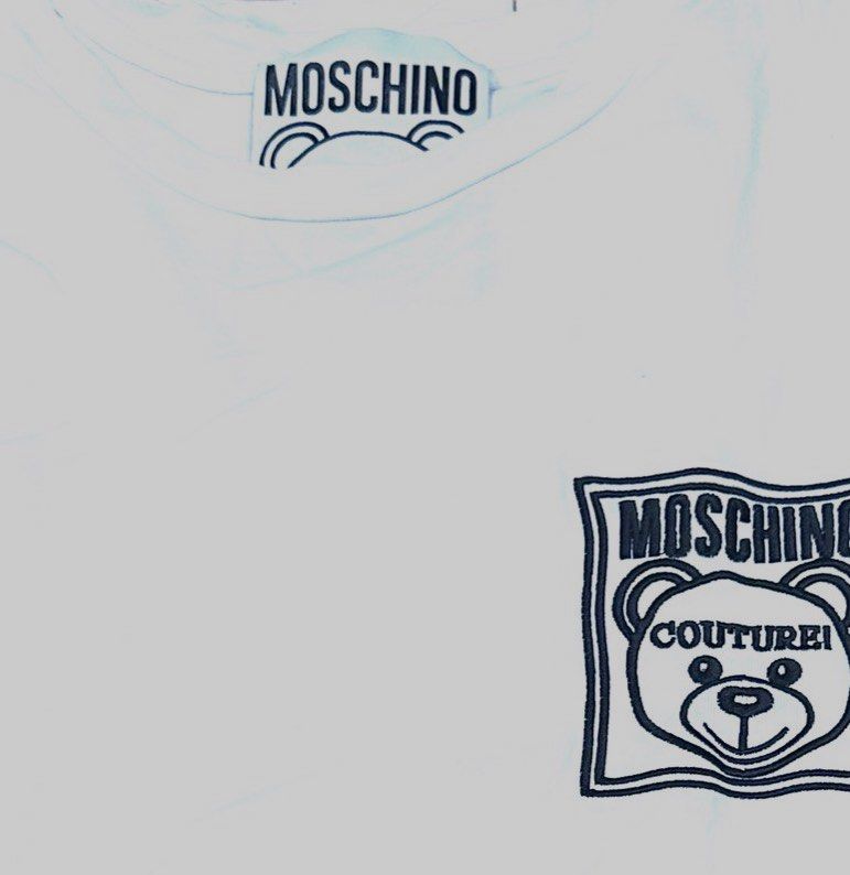 Authentic Moschino Couture Teddy Bear Patch Oversized T-Shirt (White) (Category: Shirts) located in Antipolo. Submitted by shopaho_nique (Listing ID 1468287991, Image 1). Description: 100% AUTHENTIC MOSCHINO COUTURE! Authenticity guaranteed with official AEFFE S.p.a. production tags inside (Product Code: 191D1A07791040). Not replica, not premium copy. Money back if proven fake. Very cute iconic Moschino Teddy Bear patch on the front. Premium heav