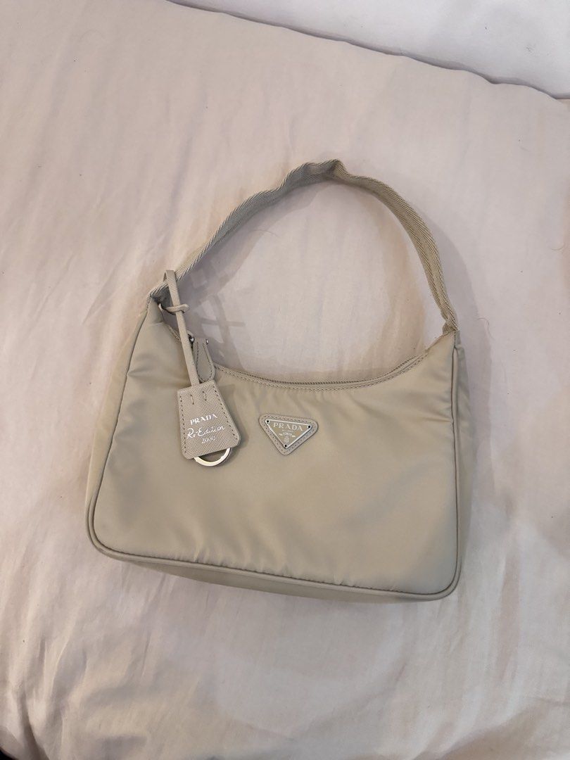 Authentic Prada Re-Edition 2000 Nylon Bag Beige (Category: Luxury Bags & Wallets) located in Manila. Submitted by closet.detash (Listing ID 1468652228, Image 1). Description: - Authentic Prada Re edition Beige - 9/10 condition, Like new - Bag only.