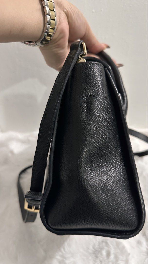 💯Authentic/Original Furla Metropolis Small Satchel Bag (Category: Luxury Bags & Wallets) located in Las Pinas. Submitted by allenscloset (Listing ID 1468624969, Image 3). Description: Minimal fading hardwares Brand: Furla Condition: Good Source: Japan Origin: Italy Style: Structured satchel / top-handle bag Color: Black with gold-tone metal hardware Features: Two rounded top handles, a front flap with a branded metal clasp, and a long shoulder s