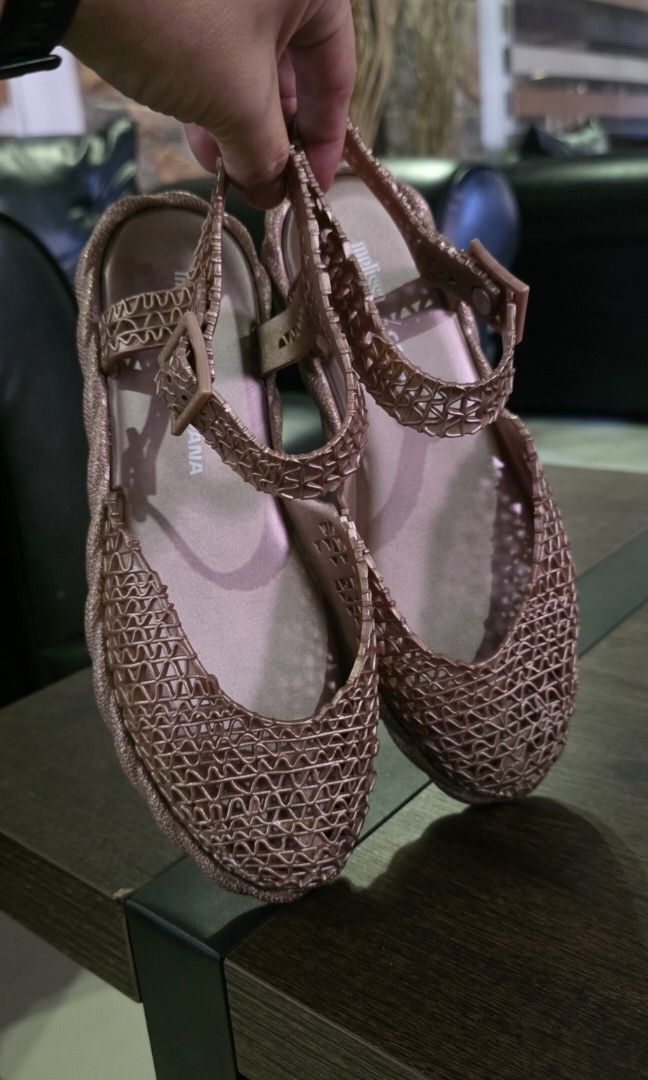 Authetic Melissa Campana (Category: Flats & Sandals) located in Apalit. Submitted by mjtwicedstyle_de_ap (Listing ID 1468548080, Image 3). Description: Authentic Melissa Campana Papel Espadrille slingback sandals in a rose/metallic gold glitter colorway, featuring the signature interwoven Melflex plastic weave designed in collaboration with the Campana brother. slightly used only size 7 US.