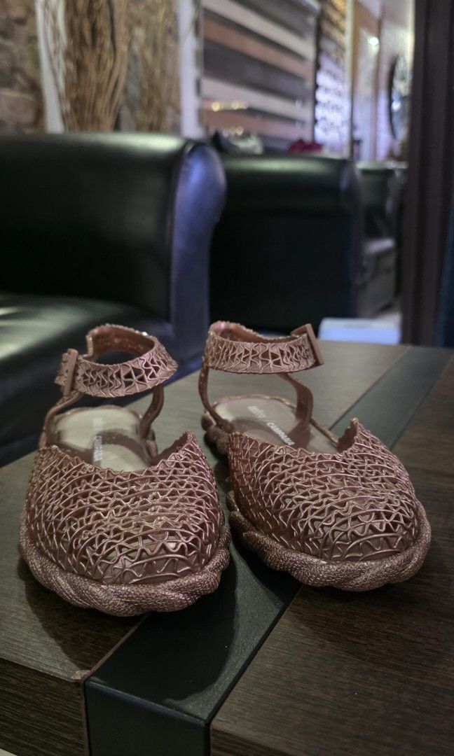 Authetic Melissa Campana (Category: Flats & Sandals) located in Apalit. Submitted by mjtwicedstyle_de_ap (Listing ID 1468548080, Image 2). Description: Authentic Melissa Campana Papel Espadrille slingback sandals in a rose/metallic gold glitter colorway, featuring the signature interwoven Melflex plastic weave designed in collaboration with the Campana brother. slightly used only size 7 US.