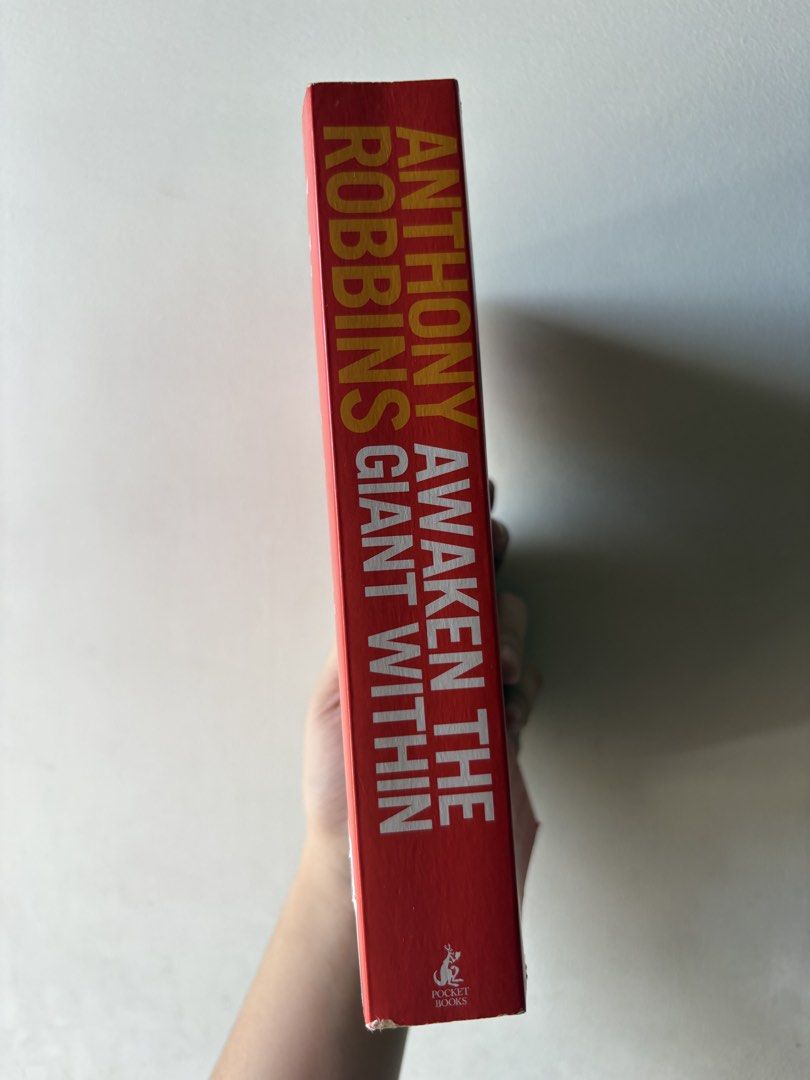 Awaken the Giant Within by Anthony Robbins (Category: Storybooks) located in Pasig City. Submitted by kairodri (Listing ID 1468524159, Image 3). Description: - Title: Anthony Robbins Classic Self-Help Book - Format: Paperback (Pocket Books edition) - Condition: Good read with colorful sticky flags marking helpful sections - Focus: Strategies for mental, emotional, physical, and financial mastery - Perfect for: Personal development and motivation.