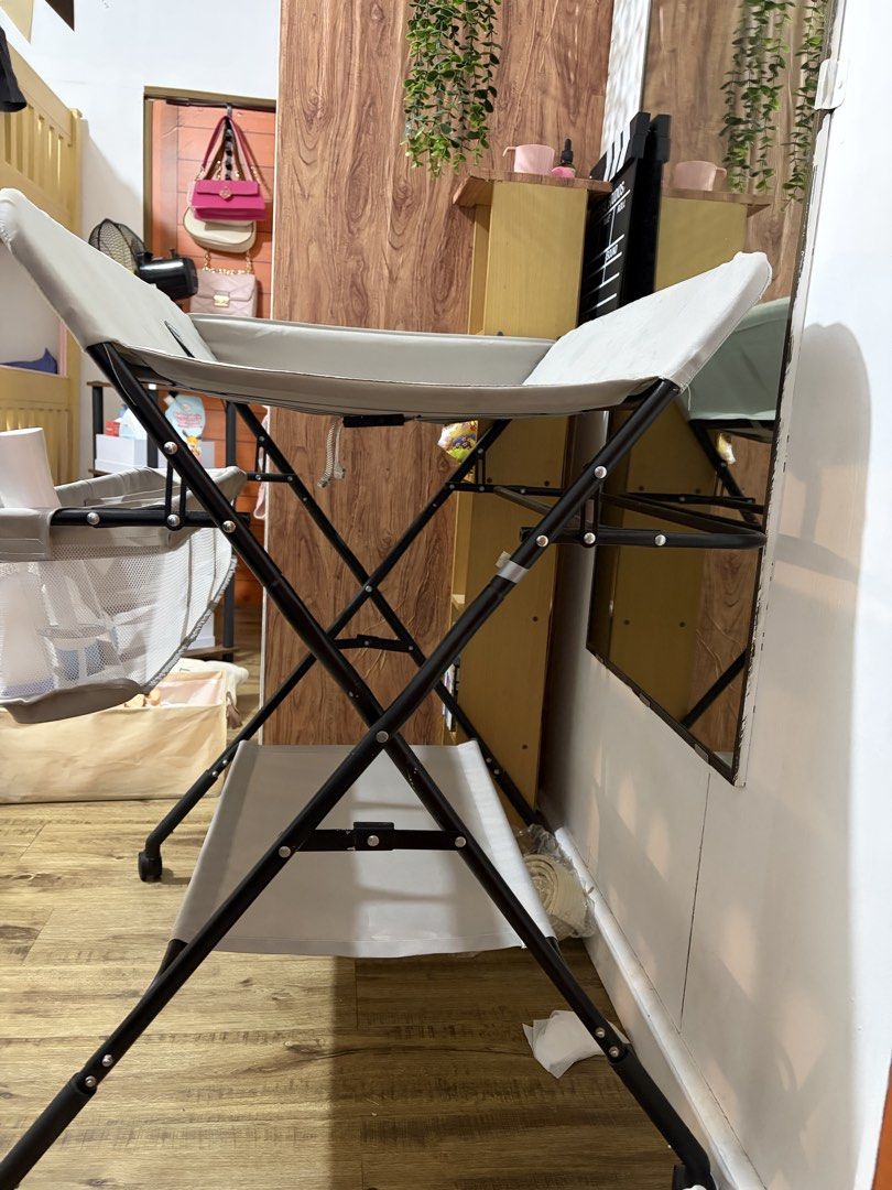 Baby Changing Table with Storage Basket and Height Chart (Category: Changing Tables & Stations) located in Quezon City. Submitted by dani_dj (Listing ID 1468580990, Image 3). Description: FOR SALE: Diaper Changing Table 👶🏻🍼 💰 Selling price: ₱800 only! 🏷️ Original price: ₱1,400 - Used for 9 months only - No known structural issues - With storage basket and lower shelf - Top changing pad is washable - Storage: Side mesh basket with multiple co