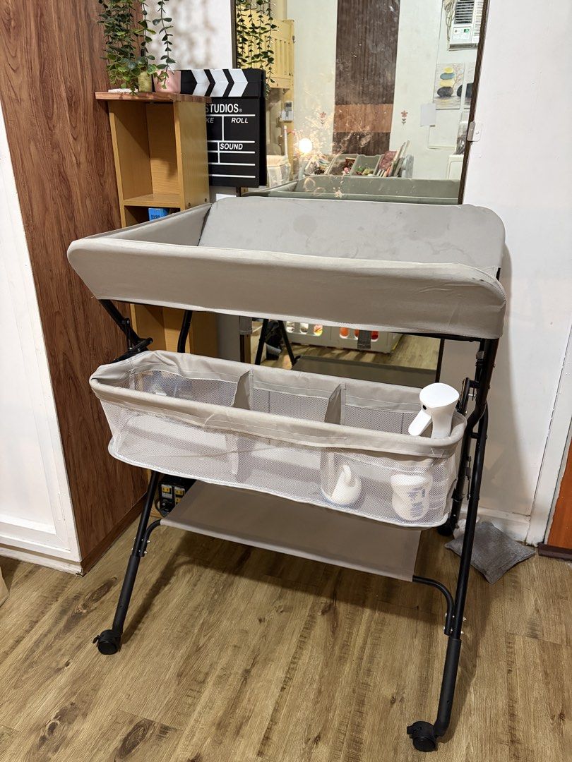 Baby Changing Table with Storage Basket and Height Chart (Category: Changing Tables & Stations) located in Quezon City. Submitted by dani_dj (Listing ID 1468580990, Image 2). Description: FOR SALE: Diaper Changing Table 👶🏻🍼 💰 Selling price: ₱800 only! 🏷️ Original price: ₱1,400 - Used for 9 months only - No known structural issues - With storage basket and lower shelf - Top changing pad is washable - Storage: Side mesh basket with multiple co