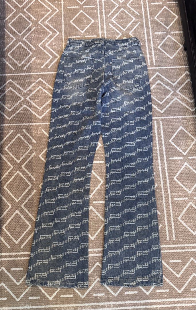 Balenciaga All Over Monogram Jeans Size S (Category: Luxury Apparel) located in Bulacan. Submitted by zyannechlo86360 (Listing ID 1468549018, Image 2). Description: - Brand: Balenciaga - Design: All-over contrasting white BB monogram pattern - Wash: Dark blue wash - Fit: Mid-rise, straight leg cut - Details: Front button closure, classic five-pocket styling - Size: S (tag attached at waistband) - Condition: Clean fabric, heavy material structure,