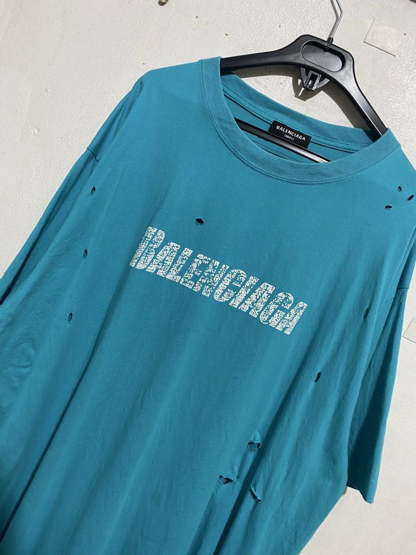 BALENCIAGA DISTRESSED SHIRT (Category: Tshirts & Polo Shirts ) located in Manila. Submitted by brndn.rgld (Listing ID 1468655667, Image 2). Description: 25 Width 32 Length Like new condition No issue Dm ur sure offer only.