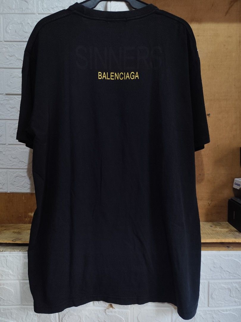 Balenciaga sinners (Category: Tshirts & Polo Shirts ) located in Kabacan. Submitted by thriftpingts (Listing ID 1468511580, Image 2). Description: Balenciaga Sinners (XL on tag) Condition: 9.8/10 Color rate : 9.8/10 W: 23 L: 30 Washtags: ✅ Issue: pinhole bottom left side stitch.