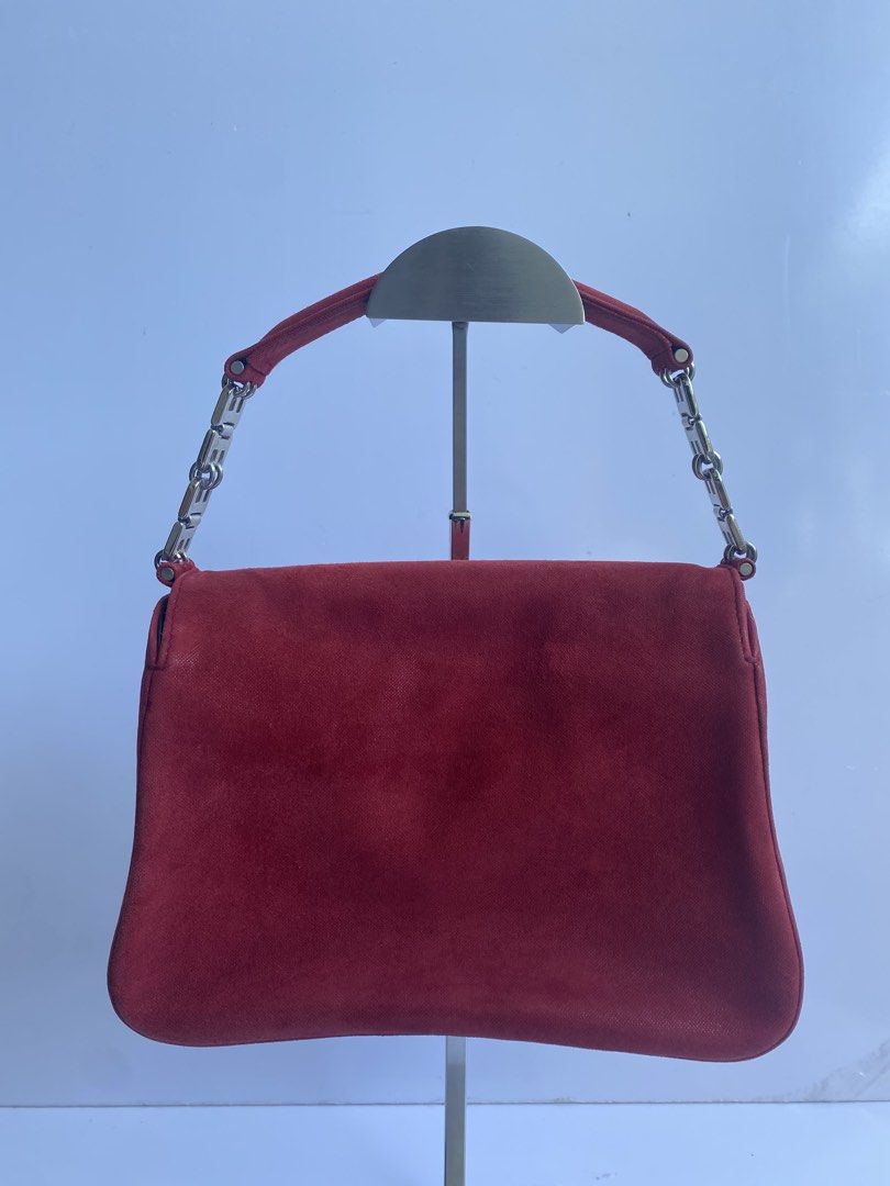BALLY Shoulder Bag B Logo Leather Red Authentic (Category: Shoulder Bags) located in Cavite. Submitted by benta_bounce (Listing ID 1468554729, Image 2). Description: - Rich red suede shoulder bag with a structured flap design and clean stitching - Eye-catching silver-tone hardware links connecting the strap to the body - Compact silhouette that securely holds your daily essentials - Clean interior lining - Minor signs of normal wear on the suede 