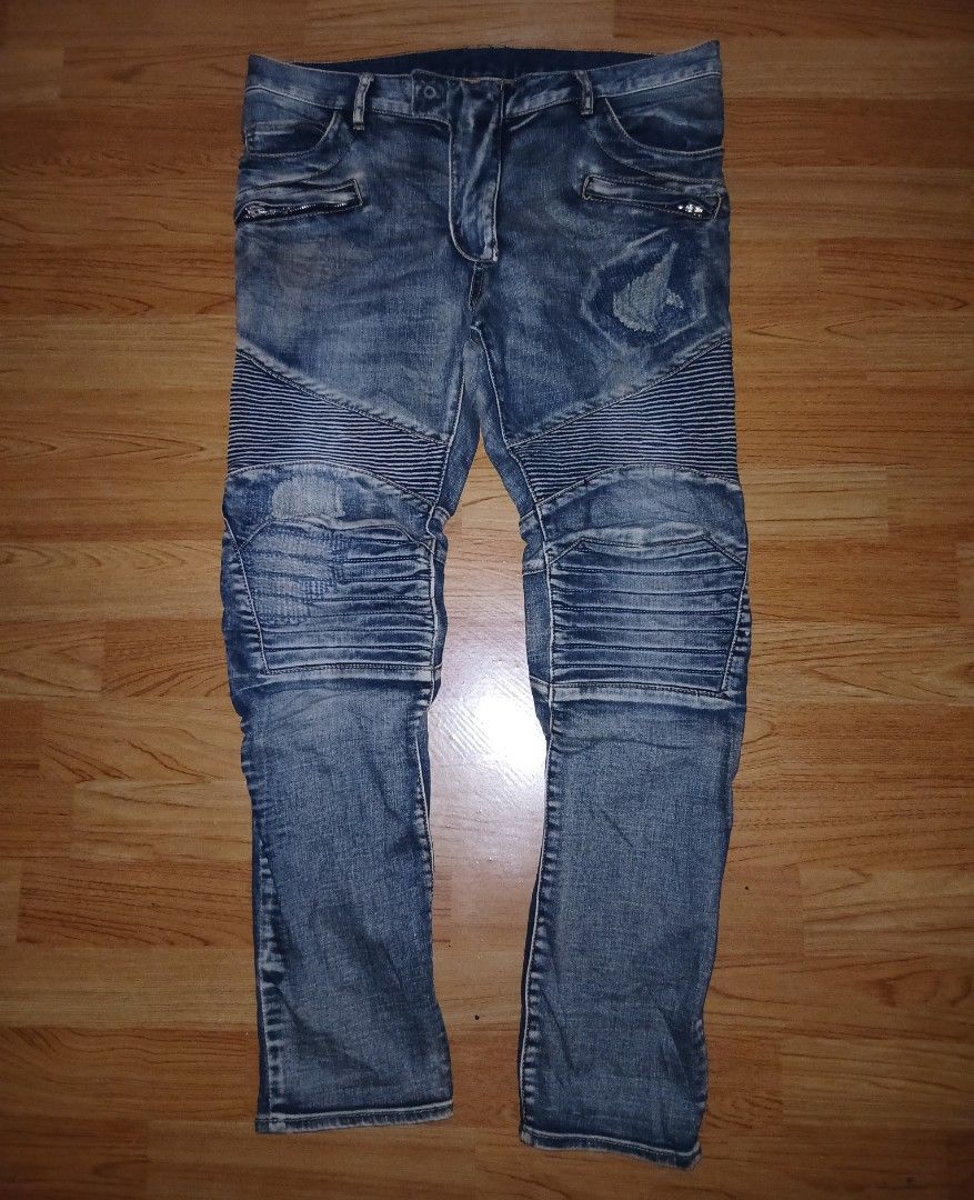 Balmain Biker Distressed Denim Jeans Blue (Category: Jeans) located in General Santos City (Dadiangas). Submitted by afsph1996 (Listing ID 1468562178, Image 2). Description: - Brand: Balmain -Size 34-36 -Length 39 -‼️‼️ issue see last 2 picture - Style: Slim-cut biker jeans in blue denim - Details: Ribbed panels at knees and waist, distressed spots, and patch accents - Hardware: Zipper pockets near waistband and heavy Balmain-branded fly zipper -