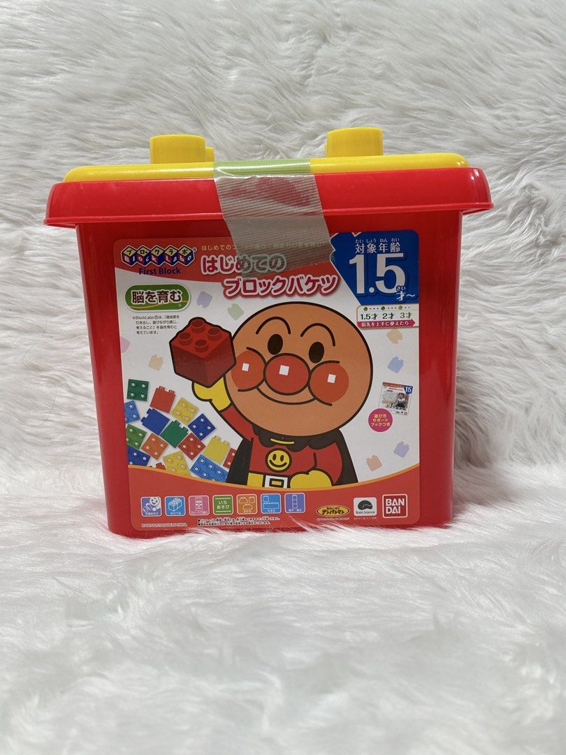 Bandai BlockLabo Anpanman First Block Bucket (Category: Lego & Building Sets) located in Cavite. Submitted by kobebean_122 (Listing ID 1468634256, Image 1). Description: - Authentic Bandai BlockLabo Anpanman building blocks - Comes in a sturdy red storage bucket with a bright yellow lid for easy cleanup - Features colorful, chunky blocks with numbers and beloved character faces - Includes fun tree structures, animal figures, and versatile buildin