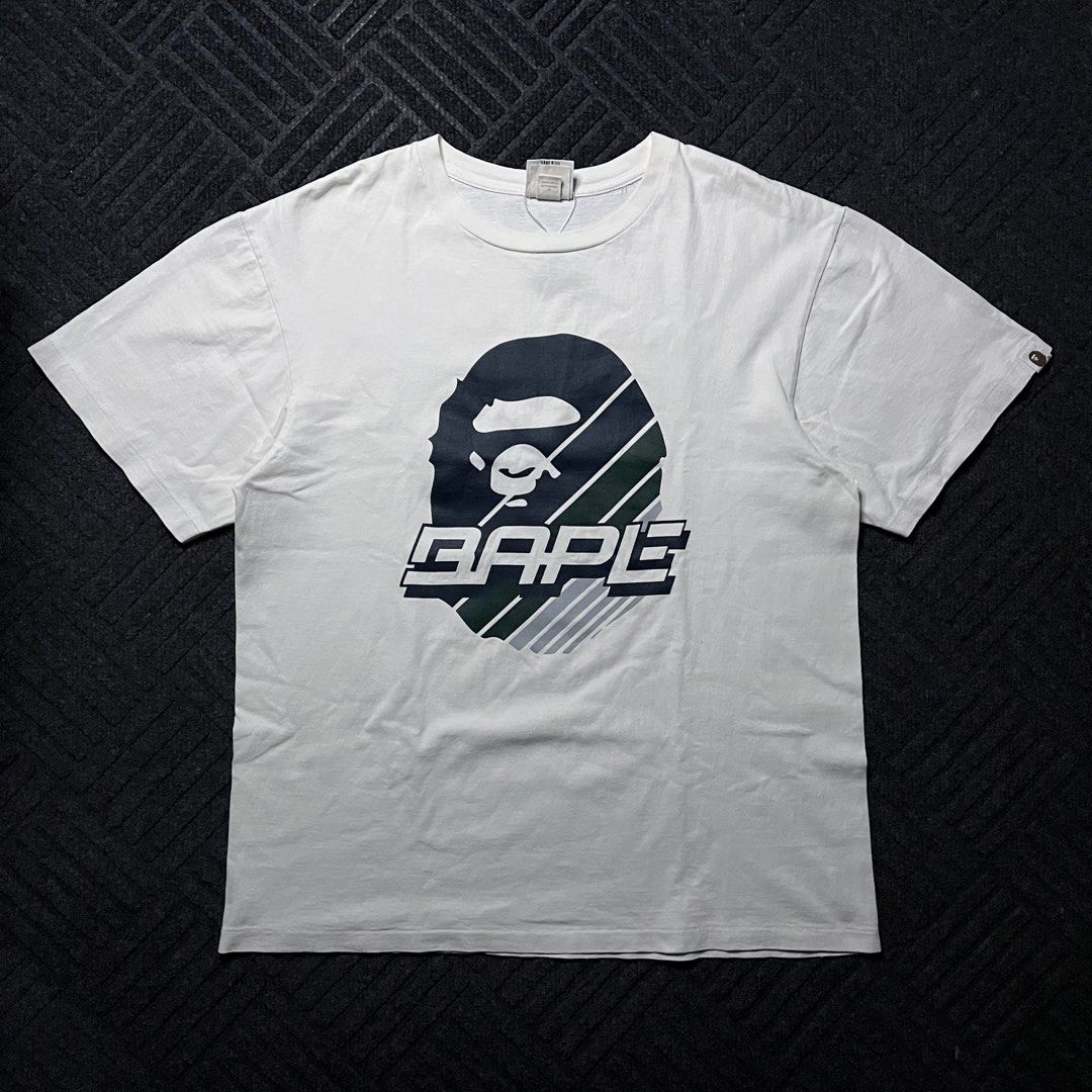 Bape Big Head Speed Racer (Category: Tshirts & Polo Shirts ) located in Davao. Submitted by archived.status (Listing ID 1468578529, Image 1). Description: COLOR MAY VARY DUE TO LIGHTING‼️ Condition: 9.5/10 Color rate: 9.5/20, or better Issue: minimal hairlines for safe Size XL Width 22 Length 28.