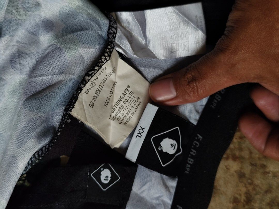 Bape x FCR (Category: Tshirts & Polo Shirts ) located in Kabacan. Submitted by thriftpingts (Listing ID 1468519666, Image 3). Description: Bape x FCR jersey (XLL on tag) Condition: 9.8/10 Color rate : 9.8/10 W: 21 L: 28 Washtags: ✅ Issue: pinholes on neck part.