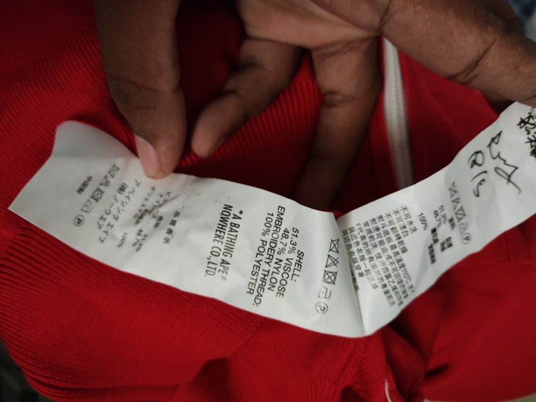 BAPY by A Bathing Ape Red White Zip Jacket (Category: Coats, Jackets and Outerwear) located in Puerto Princesa. Submitted by johnareis162386 (Listing ID 1468587820, Image 3). Description: - Brand: BAPY by A Bathing Ape - Style: Red and white zip-up jacket with mock neck collar and dual zipper pull - Details: Contrast white chest panels, matching side stripes with embroidered lettering, and ribbed cuffs/hem - Size: XS (tag on inner collar) - Mater