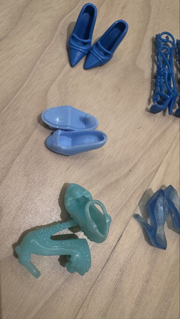 Barbie Assorted Blue Doll Shoes (Category: Kids Toys) located in Mandaluyong City. Submitted by maelovestoshop (Listing ID 1468690752, Image 2). Description: - Assorted blue doll shoes lot in various shades and translucent light blue - Fits standard fashion dolls like Barbie - Includes a variety of styles: heels, knee-high lace-up boots, pointed pumps, strappy sandals, and flats - Great for mixing and matching outfits or replacing missing accesso