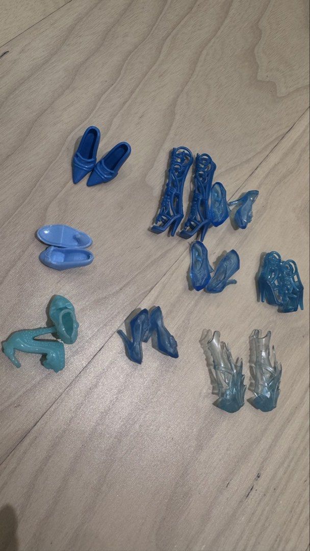 Barbie Assorted Blue Doll Shoes (Category: Kids Toys) located in Mandaluyong City. Submitted by maelovestoshop (Listing ID 1468690752, Image 1). Description: - Assorted blue doll shoes lot in various shades and translucent light blue - Fits standard fashion dolls like Barbie - Includes a variety of styles: heels, knee-high lace-up boots, pointed pumps, strappy sandals, and flats - Great for mixing and matching outfits or replacing missing accesso