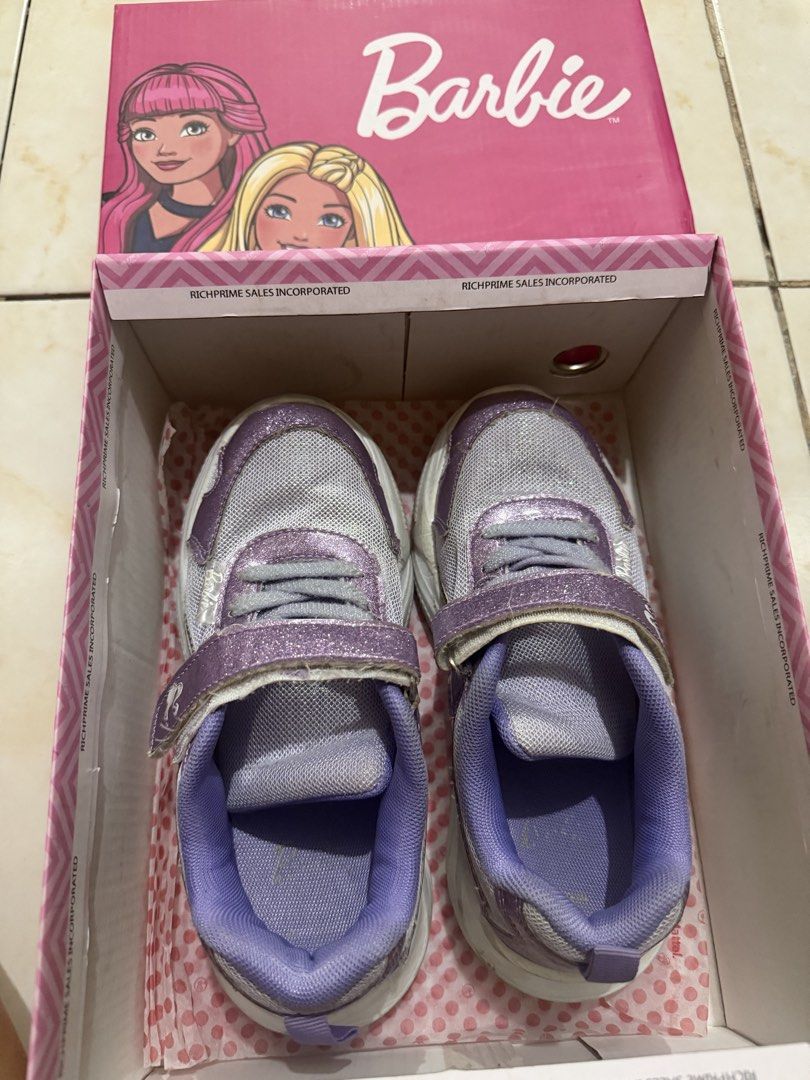 Barbie Dana Lavender Sneakers Size 2 (Category: Sneakers) located in Taguig. Submitted by heideewatts (Listing ID 1468626564, Image 2). Description: - Brand/Model: Barbie Dana Sneakers - Color: Lavender with sparkly glitter finish and white mesh panels - Size: Size 2 (approx. 21 to 24cm sole length) - Features: Chunky white sole, secure velcro strap closure over laces - Inclusion: Original pink Barbie shoebox - Condition: Gently worn with minimal