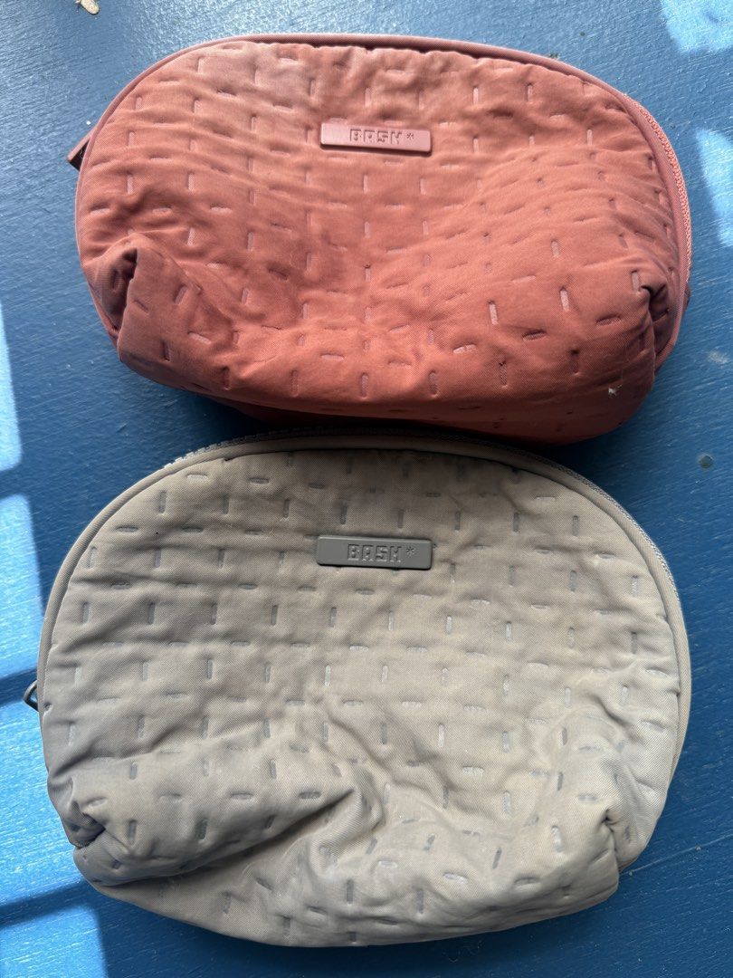 Bash Pouch Cosmetic Bag (Category: Purses & Pouches) located in Iloilo. Submitted by qwertrisha (Listing ID 1468514132, Image 1). Description: - Set of 2 cosmetic pouches in dusty rose and grey With signs of use and fading Php 300.