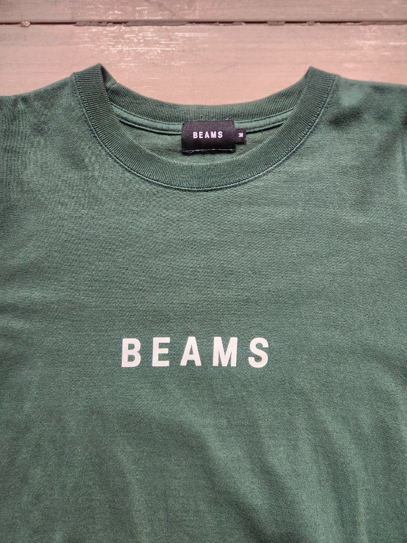 Beams Green Logo Shirt (Category: Tshirts & Polo Shirts ) located in Quezon City. Submitted by zero_two_seven (Listing ID 1468566481, Image 2). Description: - Brand: BEAMS - Color: Green - Size: M - 25 L x 20 W - Condition: 7/10 - Slight color fade due to usage - Color may differ from the photos - Shipping fee is shouldered by the buyer.