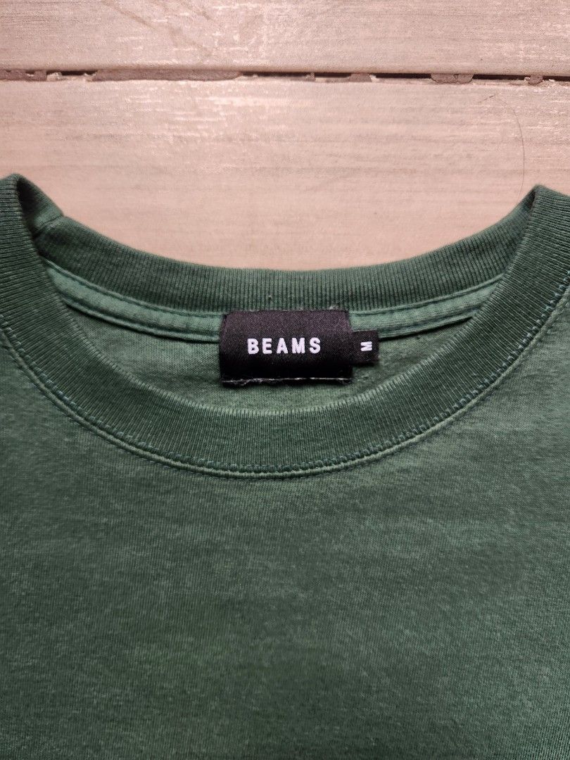 Beams Green Logo Shirt (Category: Tshirts & Polo Shirts ) located in Quezon City. Submitted by zero_two_seven (Listing ID 1468566481, Image 3). Description: - Brand: BEAMS - Color: Green - Size: M - 25 L x 20 W - Condition: 7/10 - Slight color fade due to usage - Color may differ from the photos - Shipping fee is shouldered by the buyer.