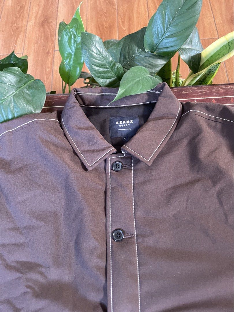 BEAMS HEART Brown Quilted Jacket (Category: Coats, Jackets and Outerwear) located in Manila. Submitted by barrybalenshagga (Listing ID 1468642542, Image 3). Description: - Brand: BEAMS HEART - Size: Small - Color: Dark brown with contrast white stitching - Lining: Quilted black lining - Closure: Button-up front - Pockets: Two large front patch pockets - Condition: Clean, versatile everyday layering piece.