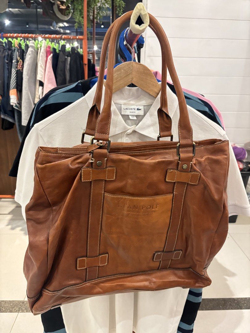 Bean Pole Brown Leather Tote Bag (Category: Tote Bags) located in Manila. Submitted by jeromskito66462 (Listing ID 1468676226, Image 2). Description: - Authentic Bean Pole brown leather tote bag with a classic vintage look - Secure zip-top closure to keep your essentials safe - Convenient front exterior pocket featuring embossed logo detailing - Clean branded fabric lining equipped with an internal zipped compartment - Complete with the original 
