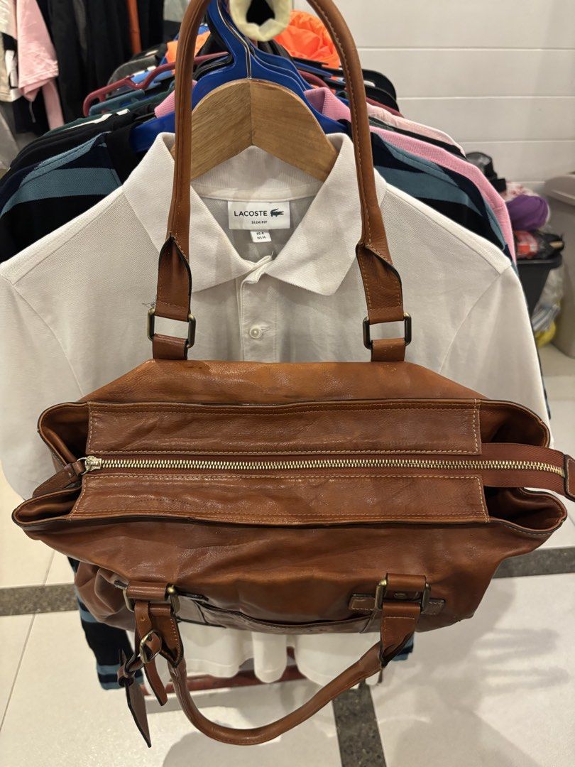 Bean Pole Brown Leather Tote Bag (Category: Tote Bags) located in Manila. Submitted by jeromskito66462 (Listing ID 1468676226, Image 3). Description: - Authentic Bean Pole brown leather tote bag with a classic vintage look - Secure zip-top closure to keep your essentials safe - Convenient front exterior pocket featuring embossed logo detailing - Clean branded fabric lining equipped with an internal zipped compartment - Complete with the original 