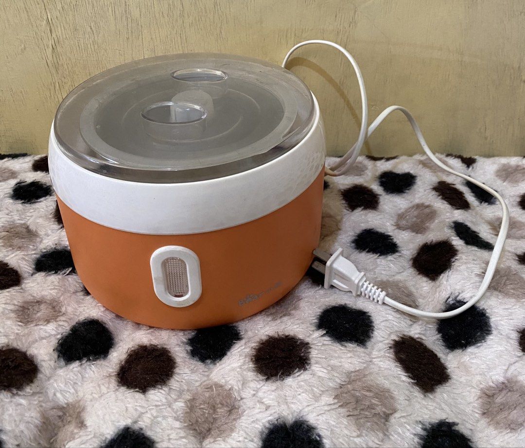 Bear Electric Yogurt Maker (Category: Cookware & Accessories) located in Baguio. Submitted by thrift_bonita (Listing ID 1468528246, Image 2). Description: - Brand: Bear - Color: Orange and white - Condition: Clean, powers on, and works perfectly - Included: Removable stainless steel inner pot, clear lid, inner bowl, and standard two-prong plug - Ideal for: Dorm rooms, quick meals, and heating small portions - Ready for immediate use.